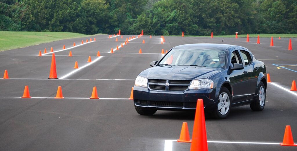Vehicle navigating a defensive-driving course